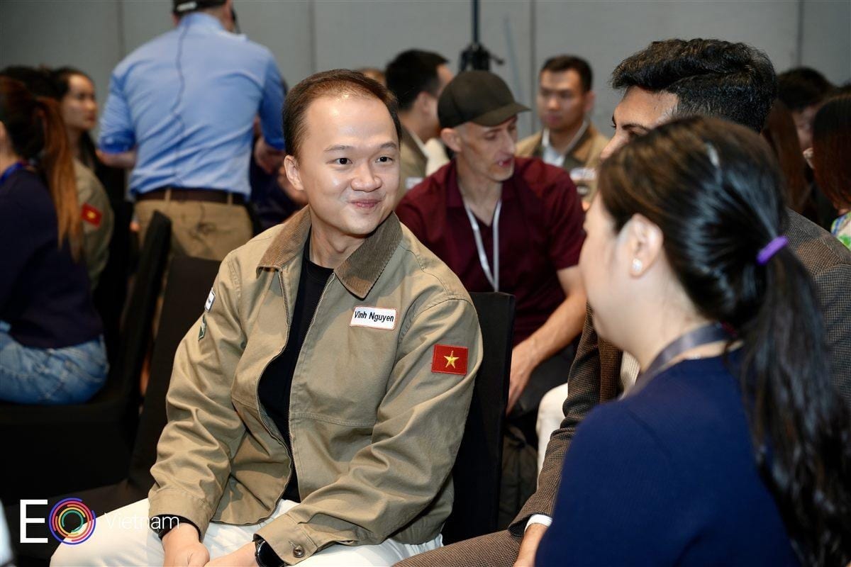 Two attendees in conversation