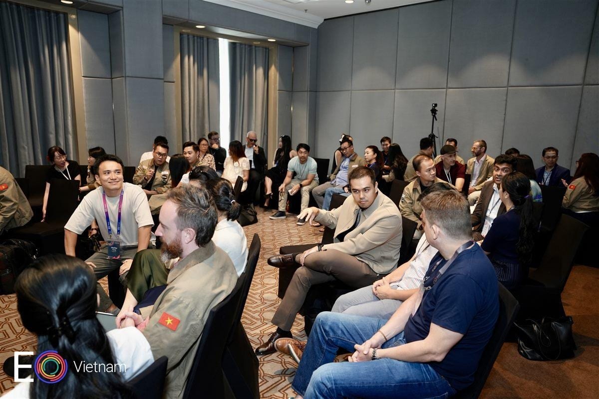 Attendees working in small groups mid-session